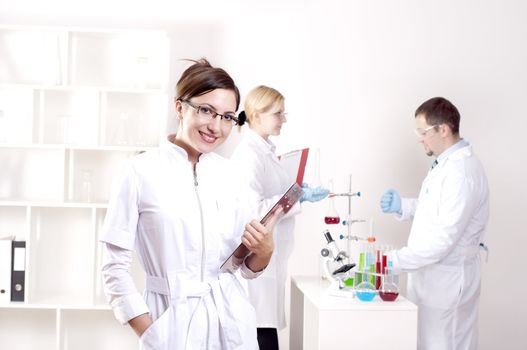 portrait of doctor, holds a tablet in the office