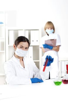 group of scientists working in laboratories with equipment