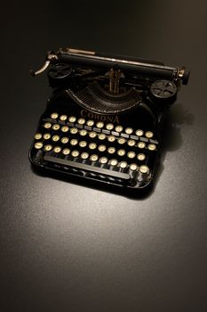 a typewriter in dramatic lighting.