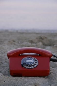 red phone on the beach on a nice day