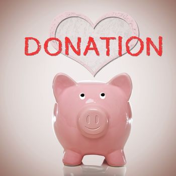 Piggy bank with heart and donation text on pink background
