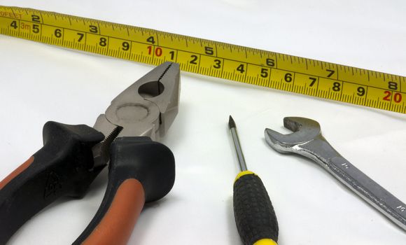 measurement and other tools as a wrench