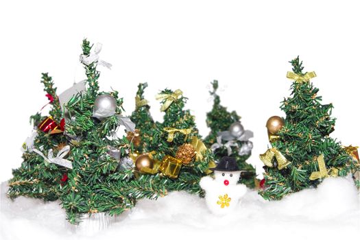 artificial christmas trees of green color with elegant ornaments