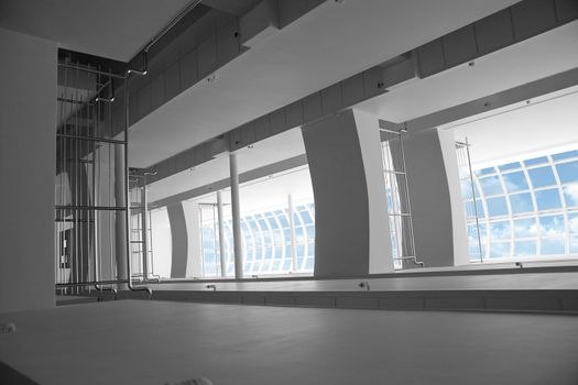 hall of a business building with columns and light from a window