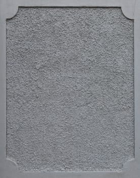 frame on a grey plaster wall (copy-space available for design)