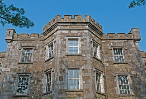 historical Cork City Gaol prison in Cork, Ireland (blue sky background)