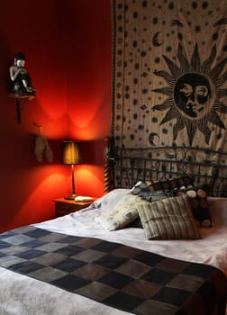 A rustic and elegant designed bedroom from a right side angle.
