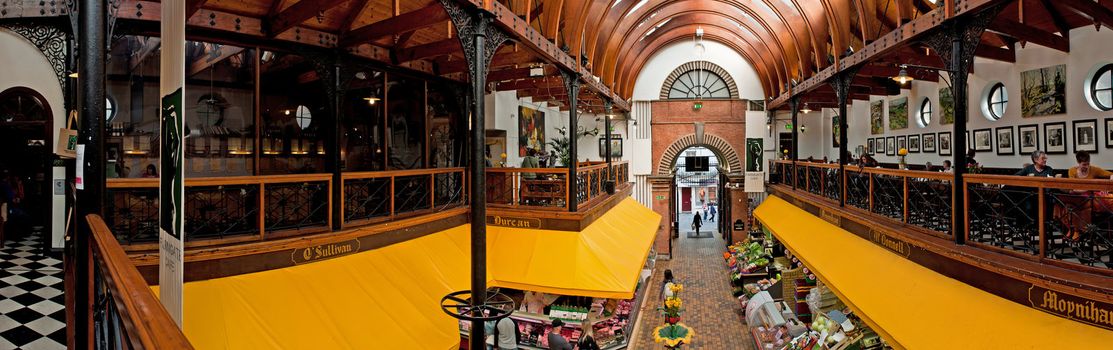 CORK, IRELAND - MARCH 26:tourists and locals at the English Market on March 26, 2012 in Cork, Ireland. The Market open since 1788 has become a tourist attraction drawing visitors from around the world