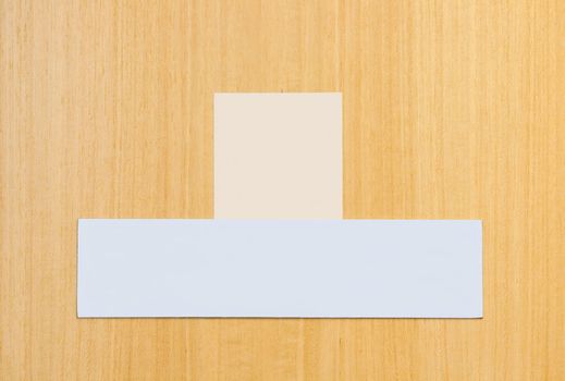 two blank signs on a wooden door (ready for some text or pictures)