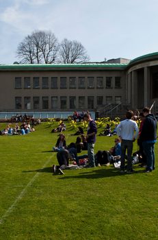 DUBLIN, IRELAND - MARCH 29: students enjoying outdoors at the cricket field in the Trinity College on March 29, 2012 in Dublin, Ireland.Ranked in 2011 by The Times as the 117th world's best university