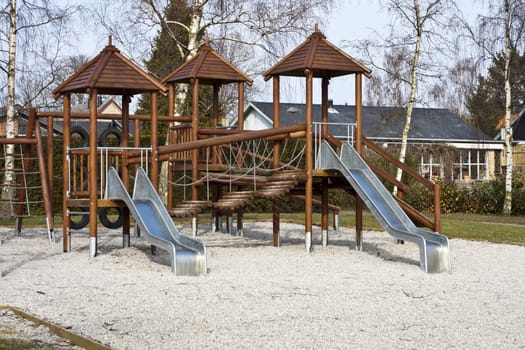 A deserted childrens play area with slides