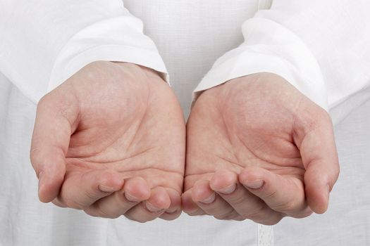 Close-up photograph of a man's open hands.