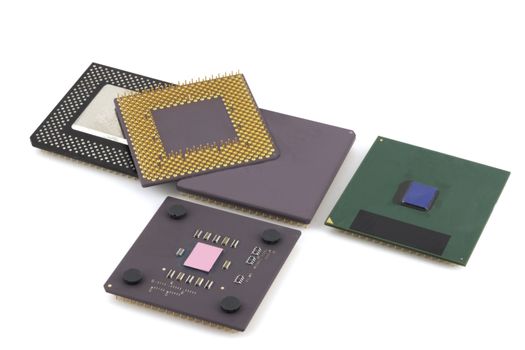 Five microprocessors over white