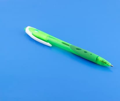 Green pen on the blue background.