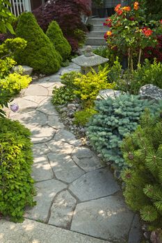 Natural flagstone path landscaping in home garden