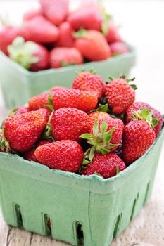 Two containers of fresh organic red strawberries