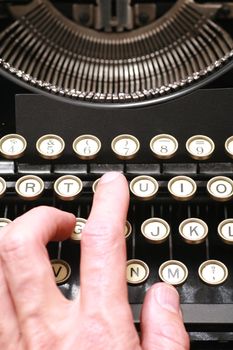 a typewriter in dramatic lighting.