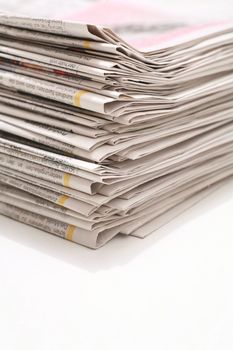 close-up of newspapers/magazine on a white backgroung.