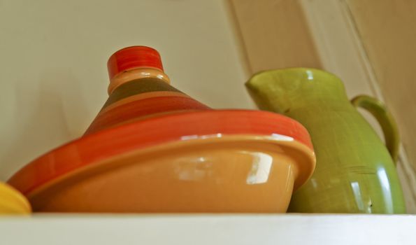 Middle eastern tagine oven and pitch on a generic cottage shelf in England