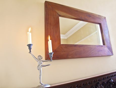 Ballerina Candelabra on the mantelpiece with oak framed mirror and chimney breast