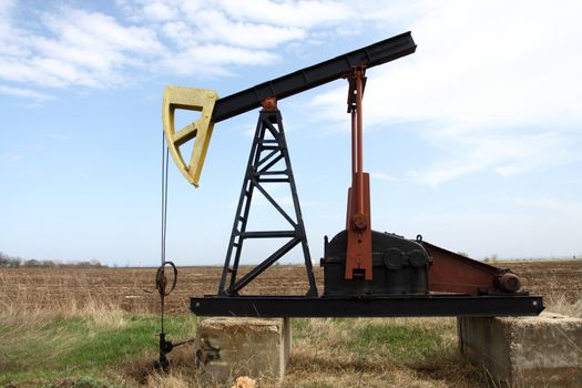  Oil pump jack working in the field
