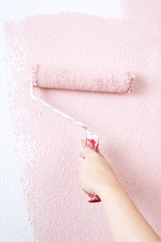 painting a wall in pink