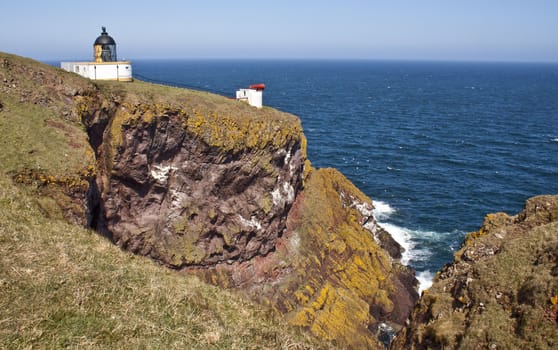 white lighthouse on a clifftop, st abbs head, Scotland