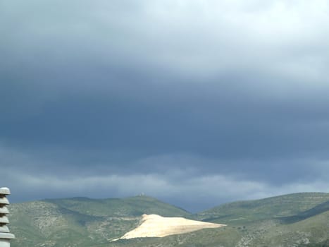 stormy cloudy sky over a mountain landscape