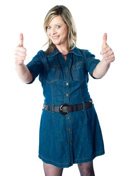 Gorgeous lady showing double thumbs-up dressed in blue attire