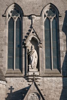 marble sculpture and windows at Saint John's cathedral in Limerick, Ireland (blue sky background)