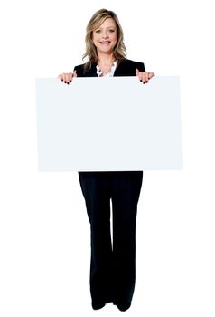 Senior beautiful woman smiling showing blank white placard isolated on white background