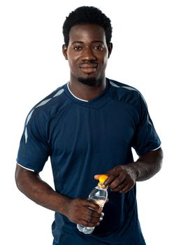 Fit man posing with water bottle isolated over white background