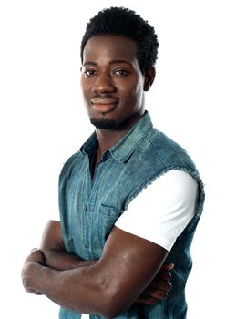 Confident african boy with folded arms against white background