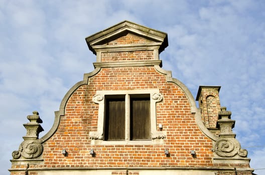 background of ancient grunge vintage architectural building on cloudy sky.