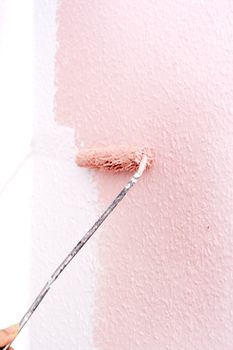 painting a wall in pink