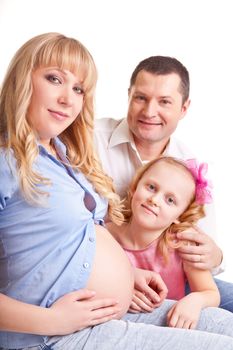 Family. A man, a pregnant woman and child on a white background