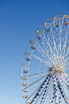 Ferris wheel against the blue sky