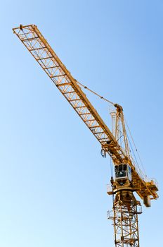 Boom of Tower crane against blue sky
