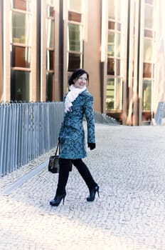 Girl walking around town with a bag