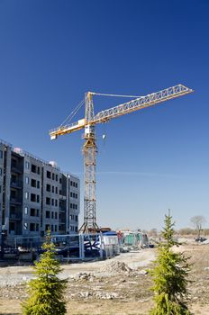 Tower crane near building under construction