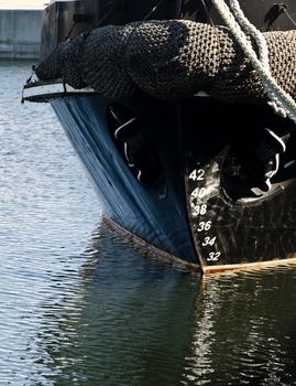 Bow of the old ship with anchor.