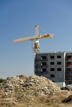 Tower crane near building under construction