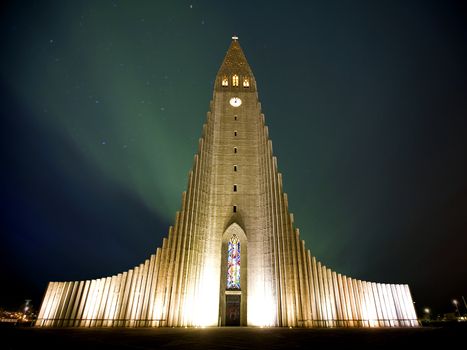 Northern lights  shining over the church in Reykjavik