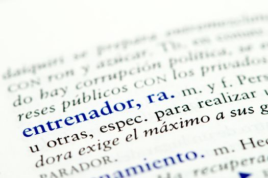 Closeup of Spanish dictionary word for coach