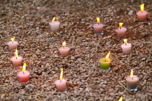 Candles in the grass at a park