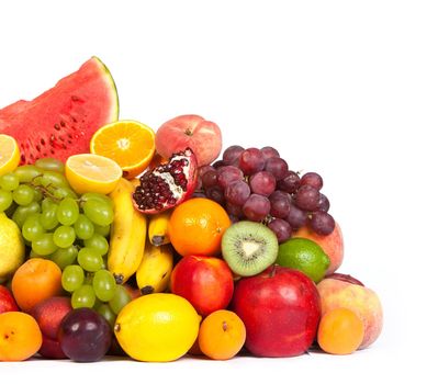 Huge group of fresh fruits isolated on a white background. Shot in a studio