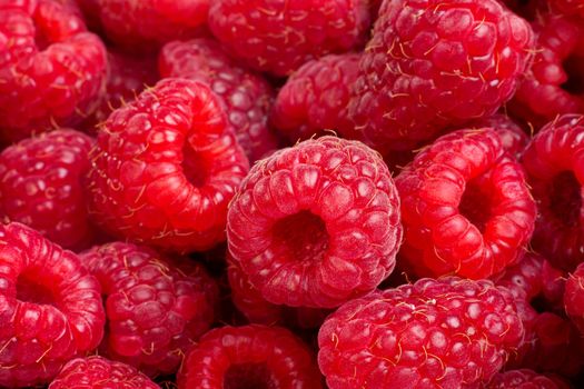 Background of ripe red raspberries, close up