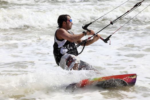 Kiteboarder enjoy surfing in ocean. Vietnam