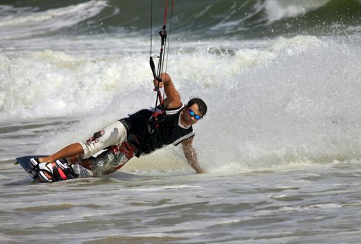 Kiteboarder enjoy surfing in ocean. Vietnam