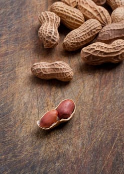 Peanuts close up on a wooden table.